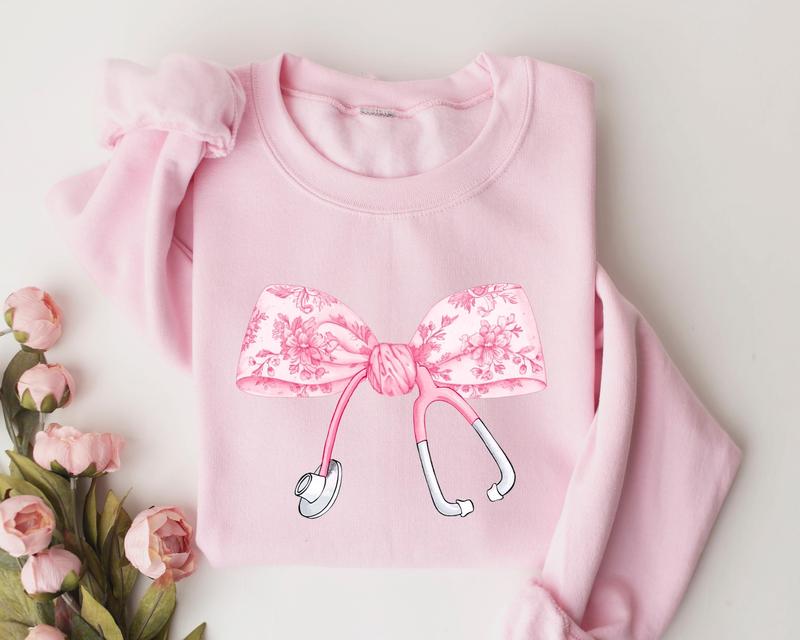Pink Coquette Nurse Stethoscope Bow Sweatshirt, Gift for Nurse, Bow Oversized Shirt, Nurse Appreciation, Christmas Gift for Nurse, Pink Bow Sweater, G